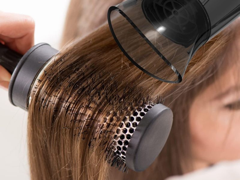 How to Straighten Hair Without Heat: 7 Easy Methods 7 Cool air blow dryer and brush smoothing hair with low heat